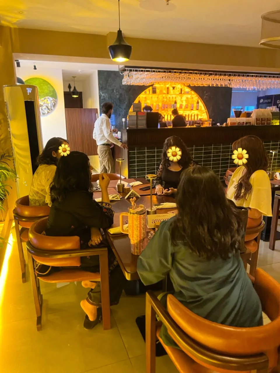 Five women gathered around a table at an Amaire dinner